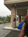 Lucien pointing out the watermark from the tsunami on the pillar of this junior high school building.